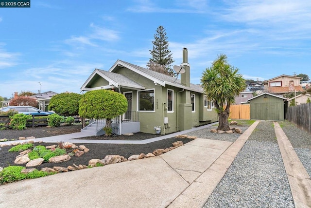 view of front of house with a storage unit