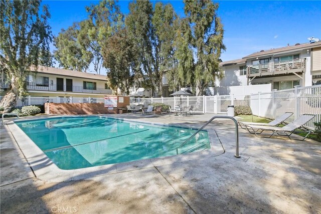 view of swimming pool with a patio