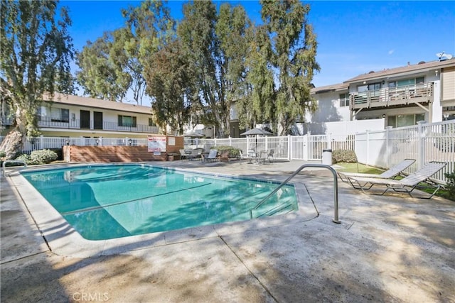 view of swimming pool with a patio area