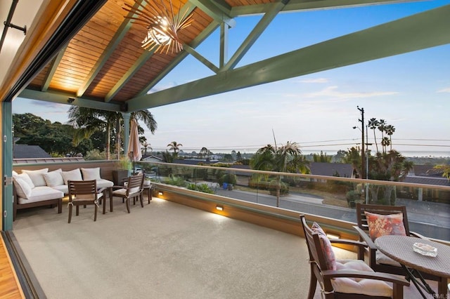 view of patio with an outdoor living space, a gazebo, and a balcony