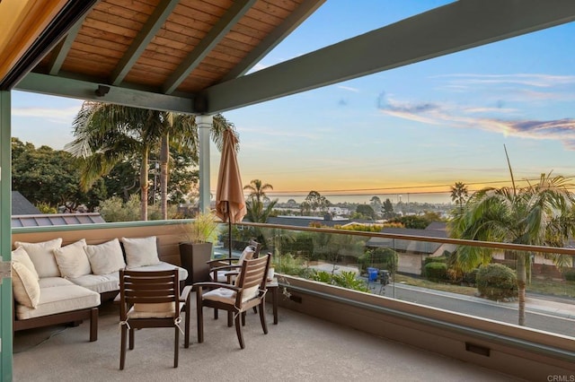 balcony at dusk with an outdoor hangout area