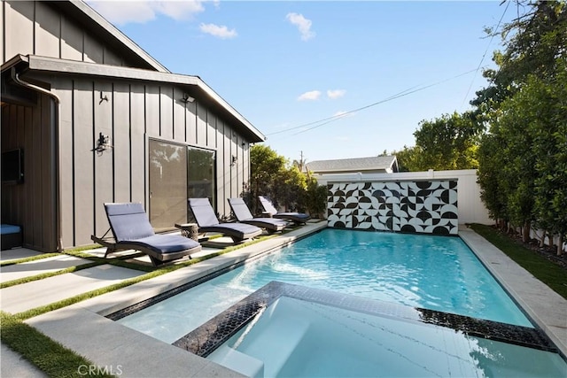 view of pool featuring a patio