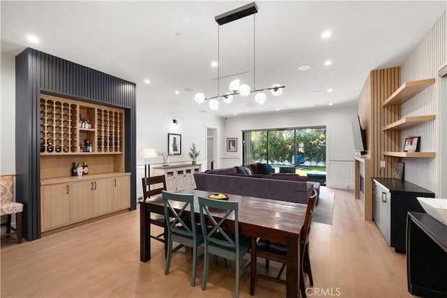 dining area with light hardwood / wood-style floors