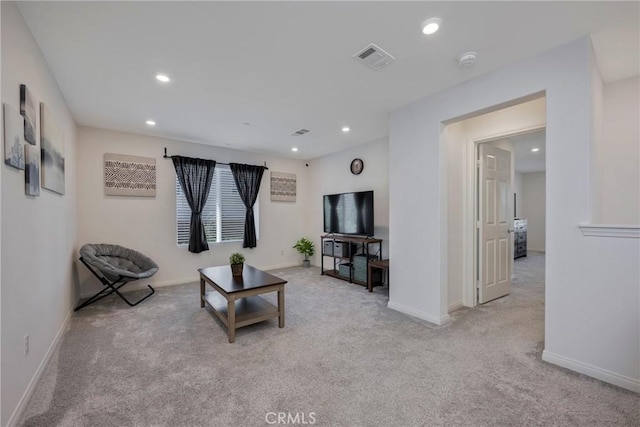 living room with light colored carpet