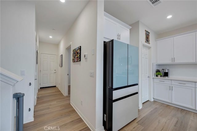 hallway featuring light hardwood / wood-style flooring