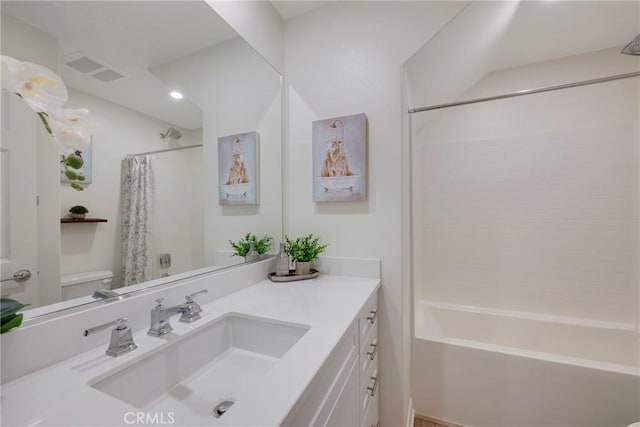 full bathroom with vanity, toilet, and shower / bath combo