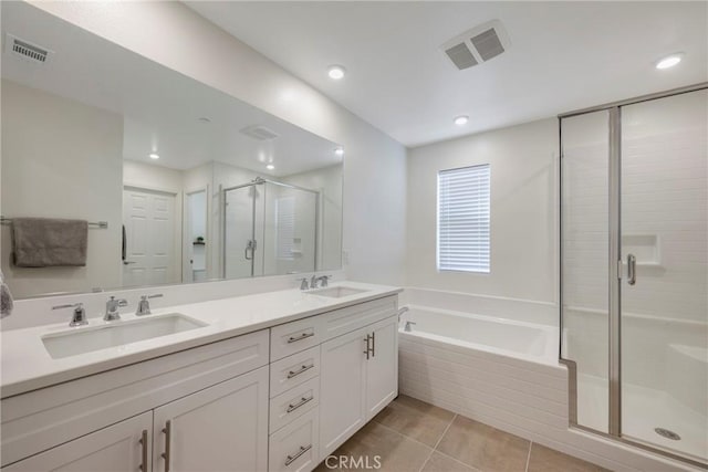 bathroom featuring vanity, tile patterned floors, and independent shower and bath