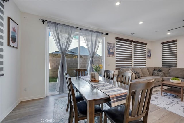 dining room with light hardwood / wood-style floors