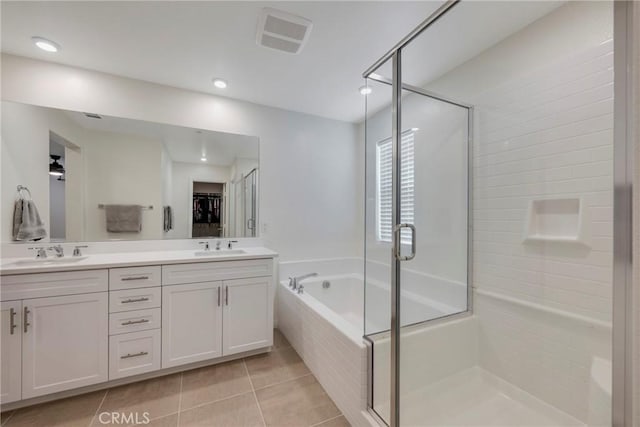 bathroom with vanity, shower with separate bathtub, and tile patterned flooring