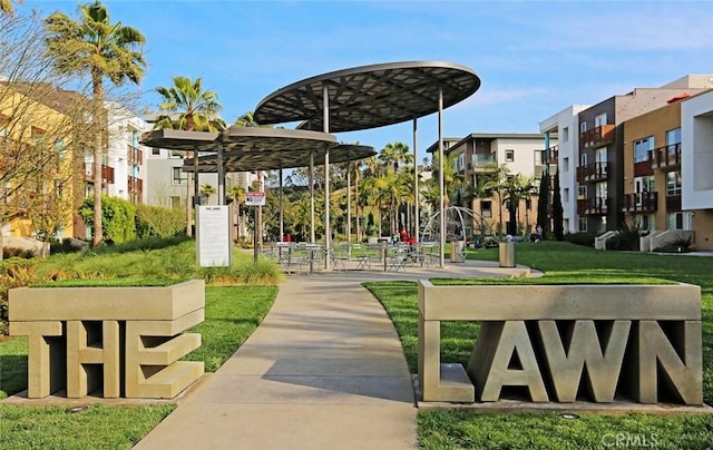 view of property's community with a lawn