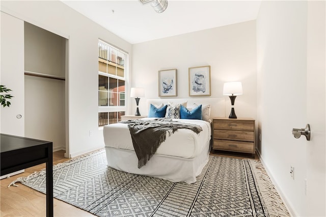 bedroom with hardwood / wood-style floors