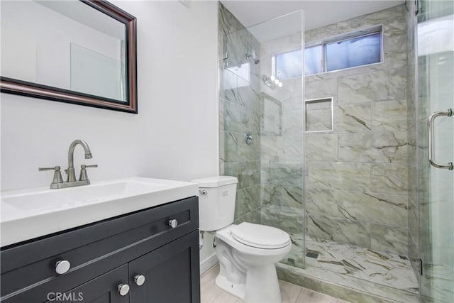 bathroom with walk in shower, vanity, and toilet