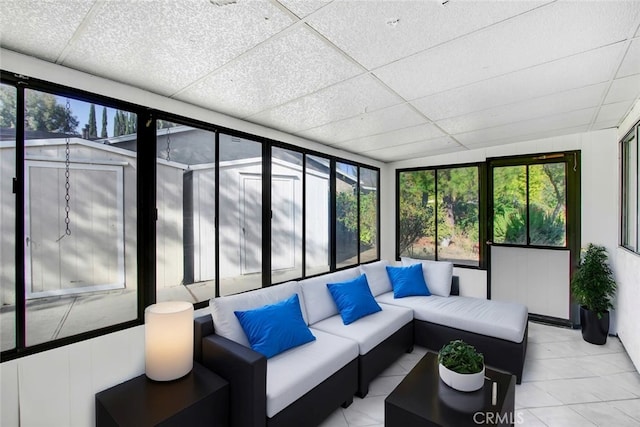 sunroom with a paneled ceiling