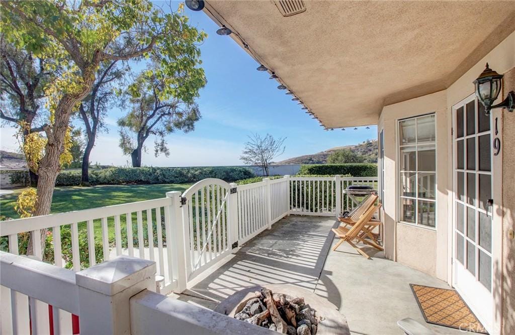 balcony featuring a fire pit