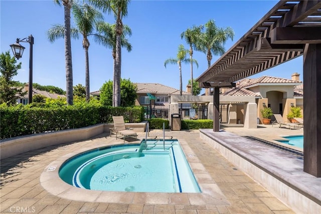 view of swimming pool with a patio area and a pergola