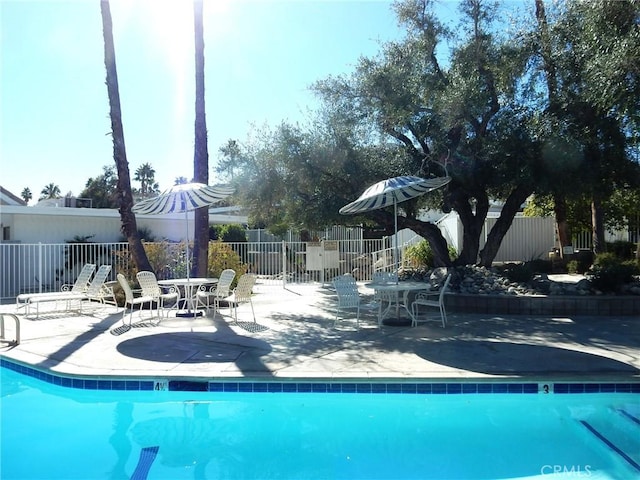 view of swimming pool featuring a patio area