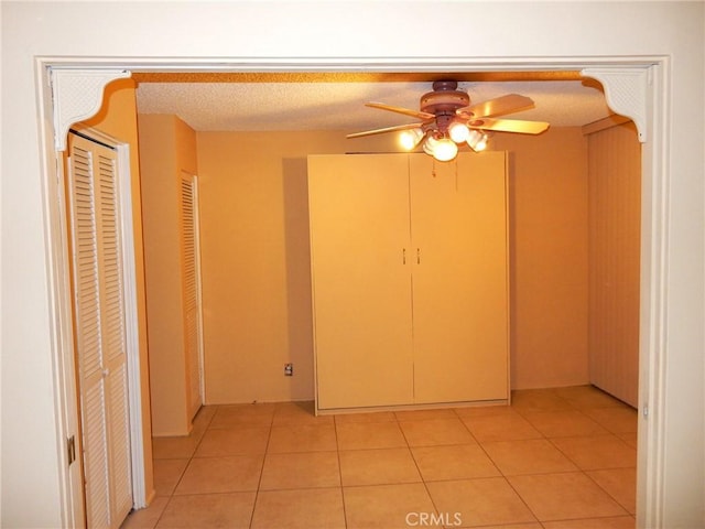 42278 Dunes View Rd Unit 28, Rancho Mirage, CA 92270 - unfurnished bedroom with light tile patterned floors, ceiling fan, and a textured ceiling