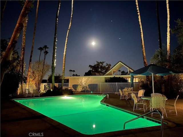42278 Dunes View Rd Unit 28, Rancho Mirage, CA 92270 - pool at night with a patio and a community pool