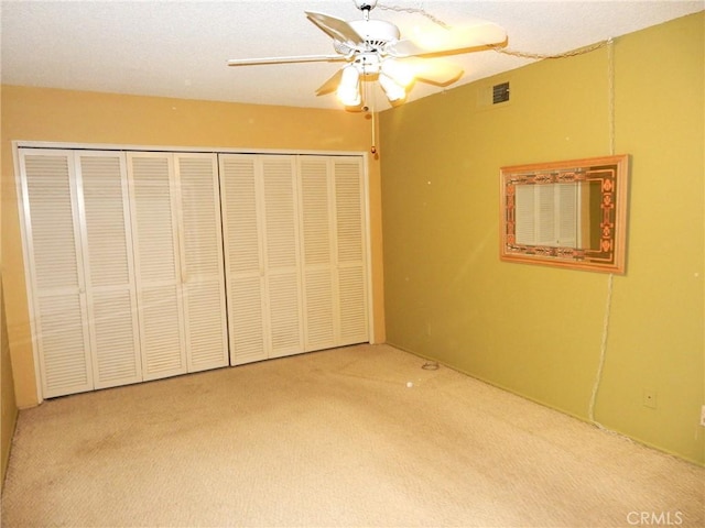 42278 Dunes View Rd Unit 28, Rancho Mirage, CA 92270 - unfurnished bedroom with carpet, a closet, and ceiling fan