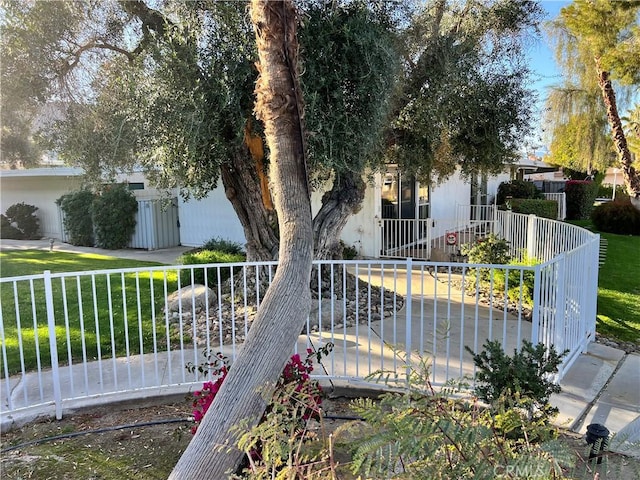 view of side of home with a lawn