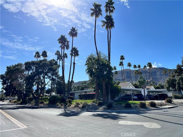 42278 Dunes View Rd Unit 28, Rancho Mirage, CA 92270 - view of asphalt road featuring a mountain view and curbs