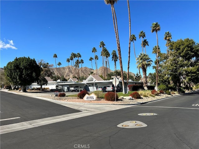 42278 Dunes View Rd Unit 28, Rancho Mirage, CA 92270 - view of asphalt road featuring a mountain view and curbs