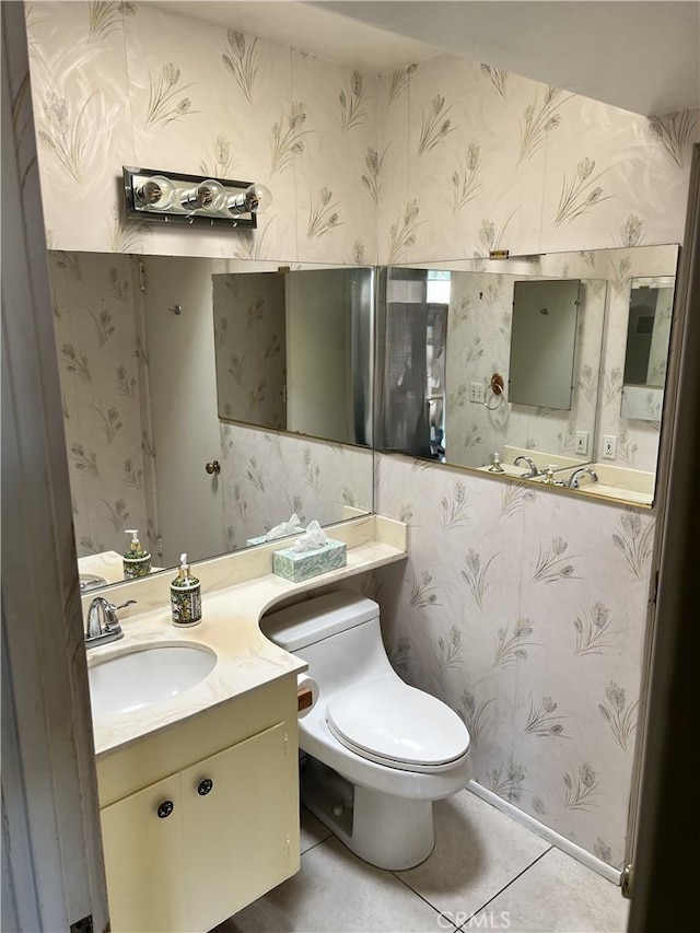42278 Dunes View Rd Unit 28, Rancho Mirage, CA 92270 - half bathroom with wallpapered walls, toilet, tile patterned flooring, and vanity