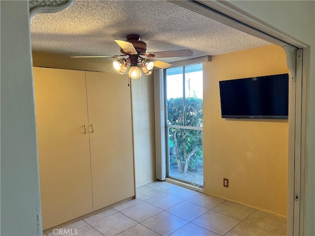 42278 Dunes View Rd Unit 28, Rancho Mirage, CA 92270 - unfurnished dining area featuring a ceiling fan, light tile patterned flooring, and a textured ceiling