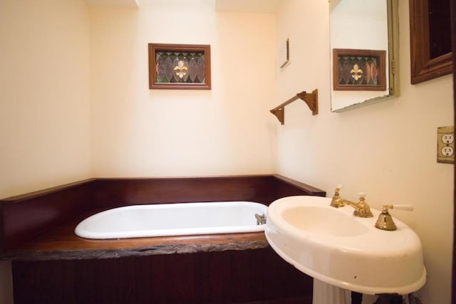 bathroom with a bathtub and sink