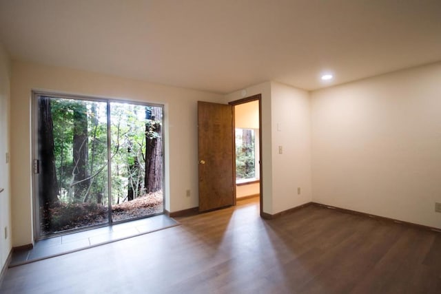 empty room with wood-type flooring