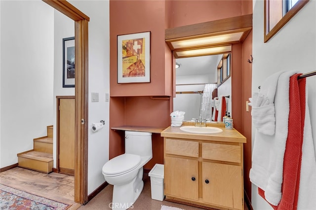 bathroom with toilet and vanity