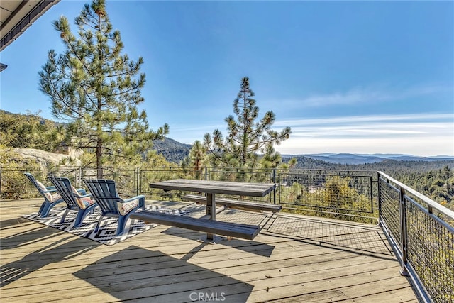 wooden terrace featuring a mountain view