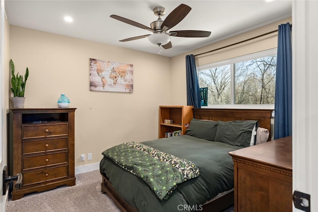 carpeted bedroom with ceiling fan