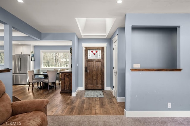 foyer with dark hardwood / wood-style flooring