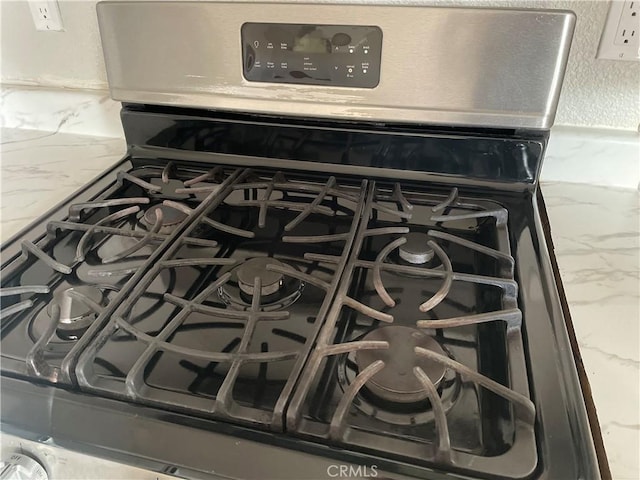 details featuring stainless steel range with gas cooktop