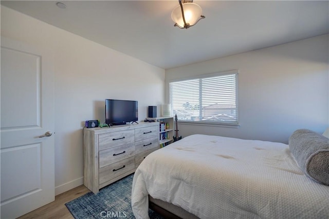 bedroom with light wood-type flooring