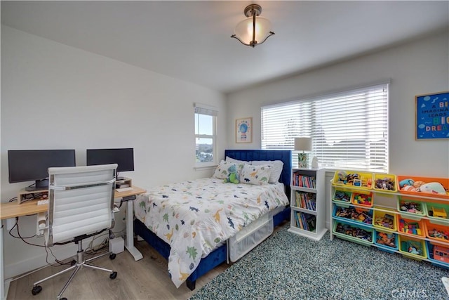 bedroom with wood-type flooring