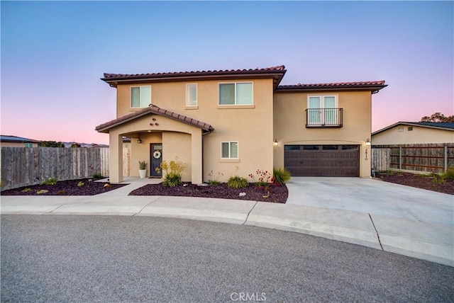 2510 Terrace Sands Ln, Oceano, CA 93445 - mediterranean / spanish-style home featuring fence, a tile roof, stucco siding, and a garage