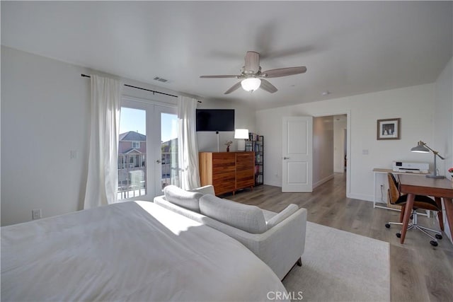 2510 Terrace Sands Ln, Oceano, CA 93445 - bedroom featuring french doors, access to exterior, baseboards, wood finished floors, and a ceiling fan
