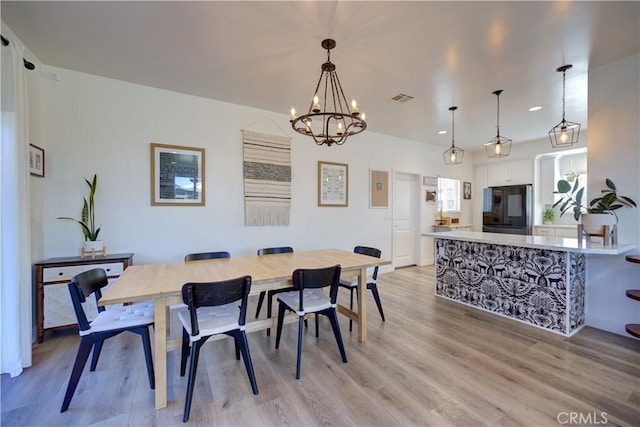 2510 Terrace Sands Ln, Oceano, CA 93445 - dining area with baseboards, visible vents, an inviting chandelier, and light wood-style floors