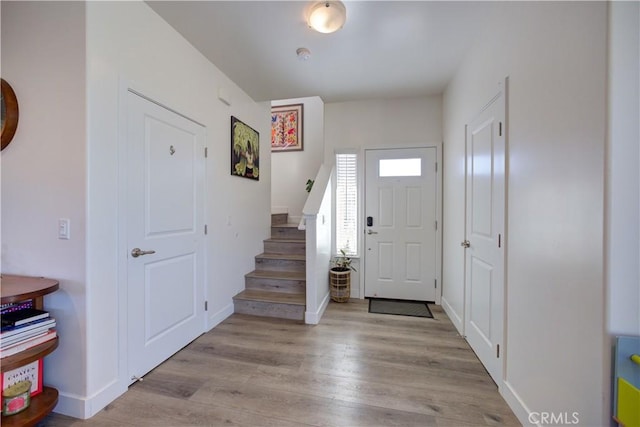 foyer with light wood-type flooring