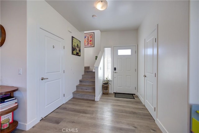 2510 Terrace Sands Ln, Oceano, CA 93445 - entryway featuring baseboards, stairway, and light wood-style floors