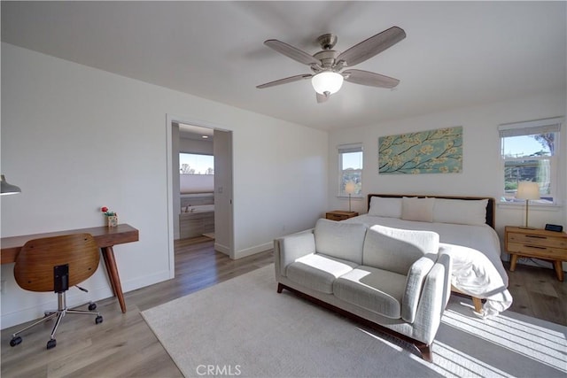 bedroom with ceiling fan and light hardwood / wood-style floors