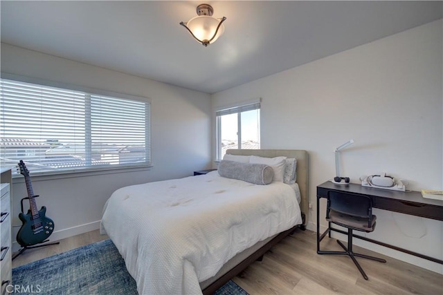 bedroom with light hardwood / wood-style flooring