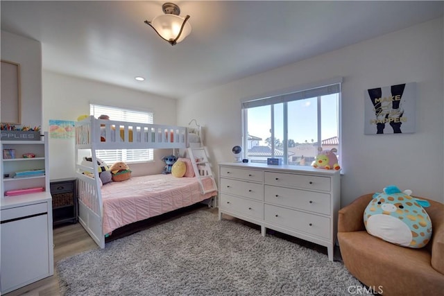 bedroom with light wood-type flooring