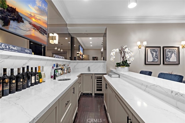 bar featuring wine cooler, a sink, ornamental molding, decorative backsplash, and dark wood finished floors