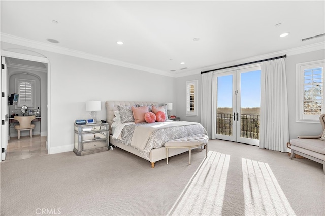 bedroom featuring access to outside, visible vents, ornamental molding, and french doors