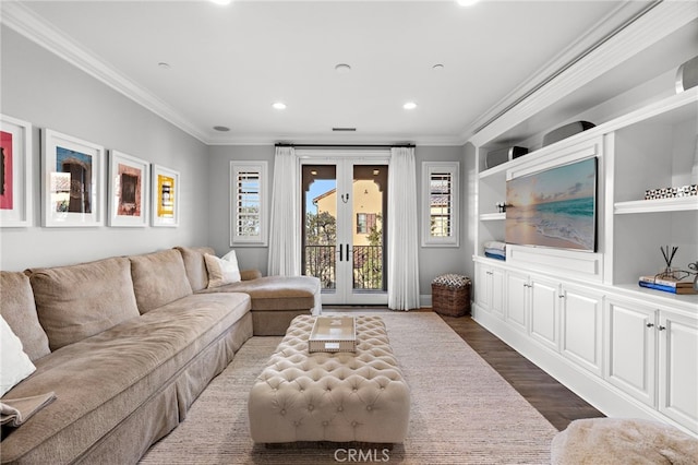 living room with dark wood-type flooring, recessed lighting, french doors, and ornamental molding