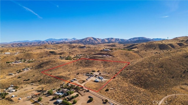 birds eye view of property with a mountain view