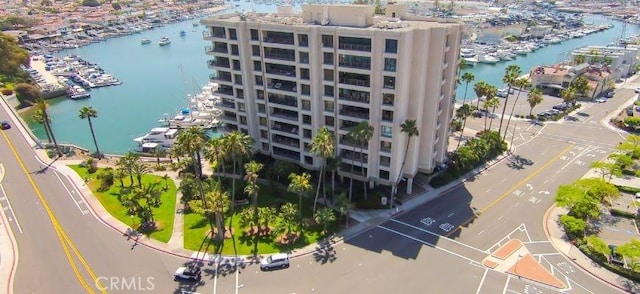 birds eye view of property with a water view